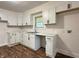 Bright kitchen featuring modern white cabinets, sleek black hardware, subway tile backsplash, and new countertops at 1032 Groff Ave, Indianapolis, IN 46222