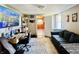 Versatile basement space with a sofa, desk area, and access to other rooms at 1117 Hendricks Ave, Shelbyville, IN 46176