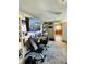 Finished basement featuring a workspace, sofa and view to the kitchen at 1117 Hendricks Ave, Shelbyville, IN 46176