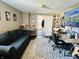 Finished basement featuring a comfortable seating area and functional workspace at 1117 Hendricks Ave, Shelbyville, IN 46176