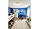 Bright bedroom with a large window, lofted bed and workstation with a TV at 1117 Hendricks Ave, Shelbyville, IN 46176