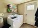 Well-equipped laundry room with modern washer, dryer, and convenient shelving at 1117 Hendricks Ave, Shelbyville, IN 46176