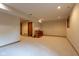 Basement area featuring a carpeted floor, recessed lighting, and access to other rooms at 11203 Westminster Way, Carmel, IN 46033