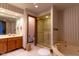 Bright bathroom features a shower, tub, and vanity with ample storage space at 11203 Westminster Way, Carmel, IN 46033