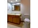 This bathroom features a vanity, mirror, toilet, and tiled floor at 11203 Westminster Way, Carmel, IN 46033