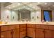 Bathroom with double vanity, large mirrors, and a cabinet offers plenty of space at 11203 Westminster Way, Carmel, IN 46033
