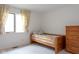 Sun-lit bedroom features a window, bed, and dresser at 11203 Westminster Way, Carmel, IN 46033