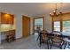 The dining room includes wooden chairs and table. There is also a desk at 11203 Westminster Way, Carmel, IN 46033
