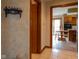 Hallway leading to a bright, functional kitchen with modern appliances and ample counter space at 11203 Westminster Way, Carmel, IN 46033