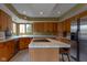This is a view of kitchen with stainless steel appliances and an island with white marble at 11203 Westminster Way, Carmel, IN 46033
