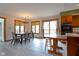 Open-concept kitchen with eating area, modern appliances, and natural light flooding the space at 11203 Westminster Way, Carmel, IN 46033