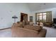 Cozy living room features vaulted ceilings, a large window and neutral carpet at 11203 Westminster Way, Carmel, IN 46033