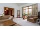 The living room features vaulted ceilings and lots of natural light at 11203 Westminster Way, Carmel, IN 46033