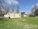 Expansive backyard featuring a detached garage and ample green space, perfect for outdoor activities at 1210 W Grant St, Thorntown, IN 46071