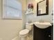 Charming half bathroom with stylish vanity, modern fixtures, and elegant decor at 1210 W Grant St, Thorntown, IN 46071