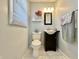 Charming half bathroom with stylish vanity, modern fixtures, and elegant decor at 1210 W Grant St, Thorntown, IN 46071