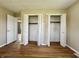Bedroom featuring hardwood floors and closets at 1210 W Grant St, Thorntown, IN 46071