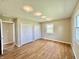 Spacious bedroom with hardwood floors, dual closets, and modern track lighting at 1210 W Grant St, Thorntown, IN 46071