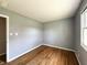 Neat bedroom showcasing hardwood floors, a light gray wall color, and good natural light at 1210 W Grant St, Thorntown, IN 46071