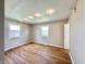 Bedroom with hardwood floors, windows, and modern track lighting at 1210 W Grant St, Thorntown, IN 46071