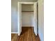 View of the walk-in closet with hardwood floors and ample storage space at 1210 W Grant St, Thorntown, IN 46071