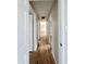 Hallway with hardwood floors connecting the bedrooms with access to the other rooms at 1210 W Grant St, Thorntown, IN 46071