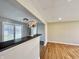 Inviting living room features pristine hardwood floors and an open kitchen view at 1210 W Grant St, Thorntown, IN 46071