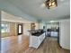 Open-concept home with living room and kitchen with bar counter with tile backsplash at 1210 W Grant St, Thorntown, IN 46071