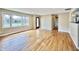 Inviting living room features pristine hardwood floors and ample natural light from a large window at 1210 W Grant St, Thorntown, IN 46071