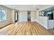 Inviting living room features pristine hardwood floors and ample natural light from a large window at 1210 W Grant St, Thorntown, IN 46071