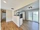 Bright living room with hardwood floors and sliding glass doors to backyard at 1210 W Grant St, Thorntown, IN 46071