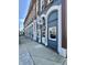 The storefront has a blue exterior, brick details, and classic barber pole signage at 1210 W Grant St, Thorntown, IN 46071