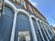 The building's exterior has a blue facade, brick details, and arched windows at 1210 W Grant St, Thorntown, IN 46071