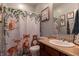 Bathroom featuring a vanity, toilet, and shower with a cute decorative curtain at 122 Stamford Dr, Pittsboro, IN 46167