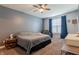 Relaxing bedroom featuring neutral paint, a ceiling fan, and natural light at 122 Stamford Dr, Pittsboro, IN 46167