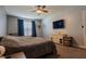 Comfortable bedroom featuring neutral paint, large window, and a ceiling fan at 122 Stamford Dr, Pittsboro, IN 46167