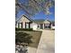 Charming brick home with well-maintained landscaping, black shutters, and a welcoming blue front door at 122 Stamford Dr, Pittsboro, IN 46167