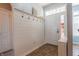 Bright foyer with coat rack, tile flooring, and direct access to other areas of the home at 122 Stamford Dr, Pittsboro, IN 46167