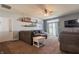 Open concept living room featuring a ceiling fan, sliding glass door, and carpet flooring at 122 Stamford Dr, Pittsboro, IN 46167