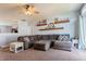 Cozy living room featuring carpet flooring, comfortable seating, and lots of natural light at 122 Stamford Dr, Pittsboro, IN 46167