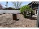 View of a yard with privacy fence, plantings, a burn barrel and an outdoor living space with pergola at 1229 Dallas Dr, Plainfield, IN 46168