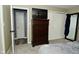 This bedroom features neutral carpet, a closet with double doors, and a flatscreen tv at 1229 Dallas Dr, Plainfield, IN 46168
