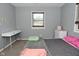 This bedroom features a window for natural light, light-colored walls, and neutral carpet at 1229 Dallas Dr, Plainfield, IN 46168