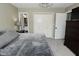 This bedroom features neutral carpet, a closet with double doors, and a tv at 1229 Dallas Dr, Plainfield, IN 46168