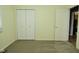 This bedroom has neutral carpeting and a double-door closet at 1229 Dallas Dr, Plainfield, IN 46168