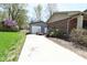 Long driveway leading to detached garage and back yard at 1229 Dallas Dr, Plainfield, IN 46168