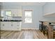 Bright kitchen features stainless steel sink and bar top area for seating at 1229 Dallas Dr, Plainfield, IN 46168