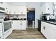 Well-lit kitchen featuring white cabinets and stainless steel appliances at 1229 Dallas Dr, Plainfield, IN 46168