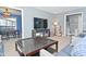 Living room with large tv, gray walls, and a view to the adjacent dining room at 1229 Dallas Dr, Plainfield, IN 46168