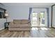 Cozy living room featuring a comfortable couch and a bright view to the outdoor area at 1229 Dallas Dr, Plainfield, IN 46168
